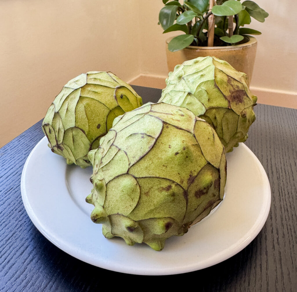 Plate with ripe cherimoyas.